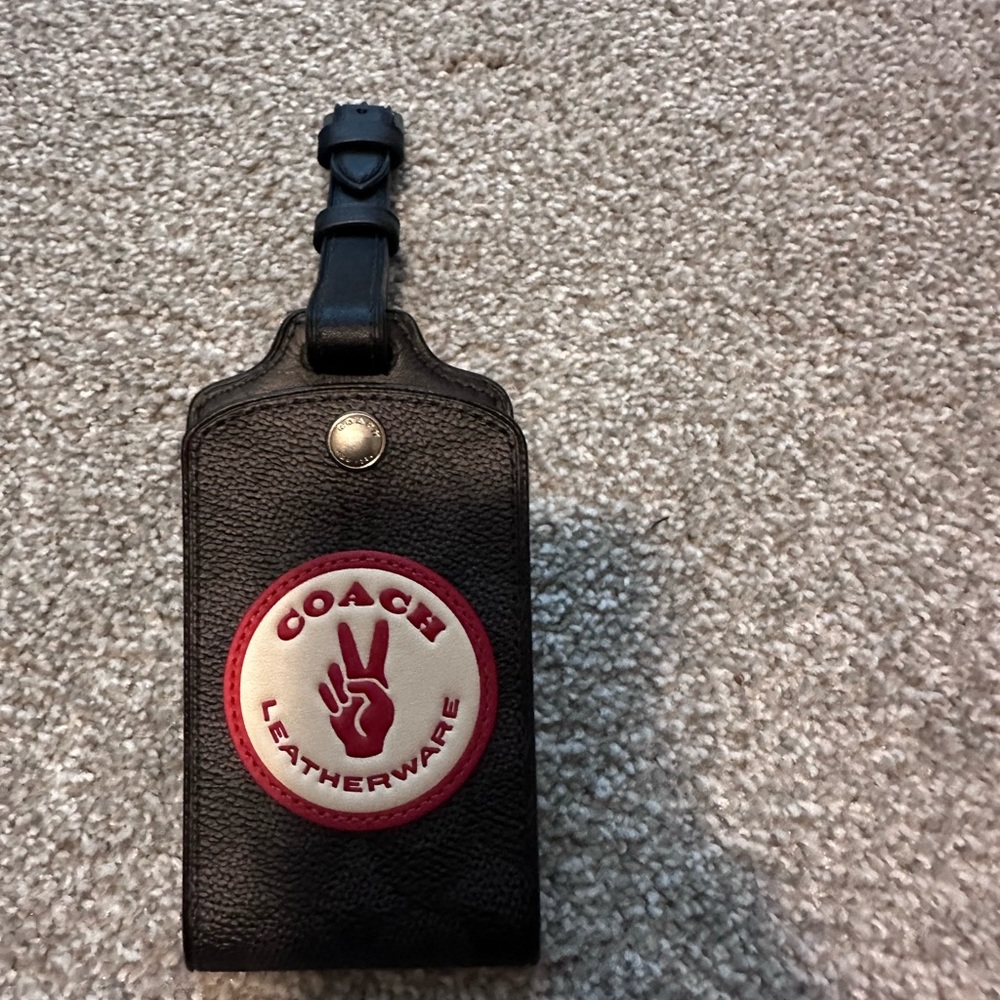 Coach leather baggage tag in signature jacquard
